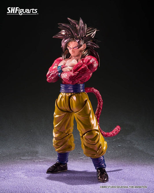 SH Figuarts Super Saiyan 4 goku action figure from Dragon Ball gt, standing in a dynamic pose with arms crossed over his chest. The figure features his signature metallic gold gi pants, a blue waistband, a pink Super Saiyan hairpiece, and a long pink tail, set against a dark studio background.
