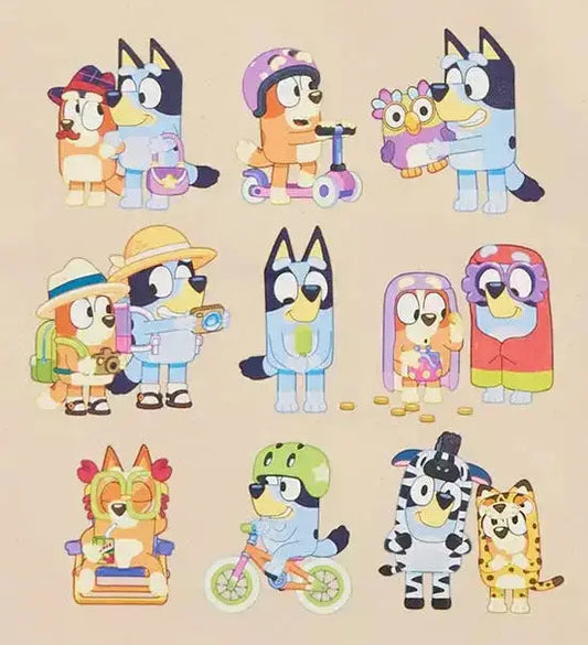Beige tote bag with Bluey and Bingo cartoon characters illustrations on a white background