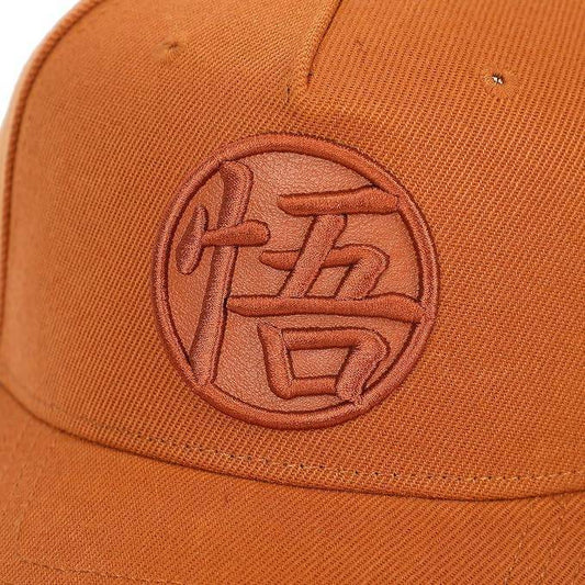 Orange Dragon Ball Z Goku's Symbol cap with a logo on a white background