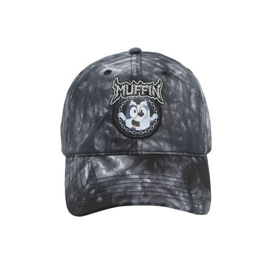 Black tie-dye cap with a cartoon character of 'Muffin' from the show Bluey on a white background