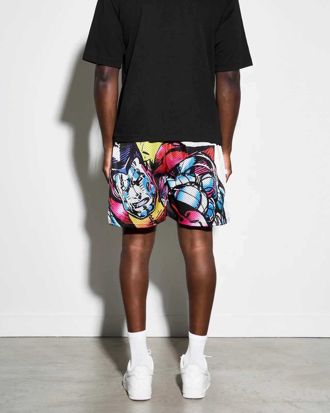 Colorful athletic shorts with Marvel X-men Colossus graphic design on a white background