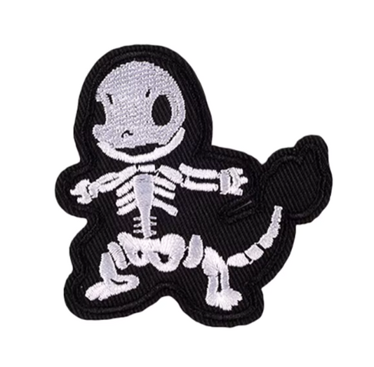 Skeleton pokemon charmander patch with black outline on a white background