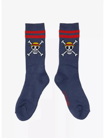 Pair of navy blue One Piece straw hat crew socks with skull and crossbones design on a white background