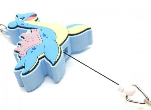 A blue and yellow pokemon lapras keychain or bag clip with a black retractable cord and a small metal ring, shown on a white background.