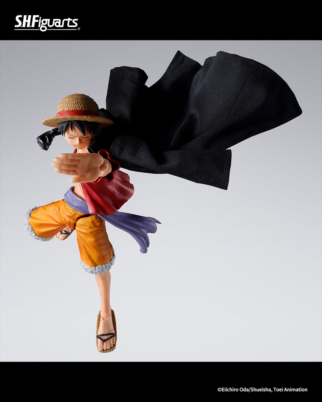 SH Figuarts One Piece Luffy action figure in a dynamic pose with his straw hat, red vest, orange shorts, purple sash, and black cape against a light gray studio background.