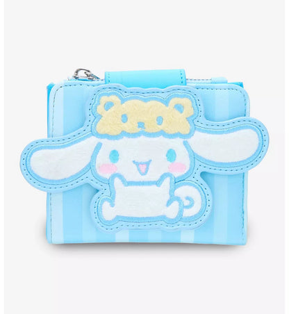 A light blue and white striped Cinnamoroll Bear Hat Mini Zipper Wallet featuring a large applique of a cartoon character with a yellow bow head, shown on a plain light gray background.