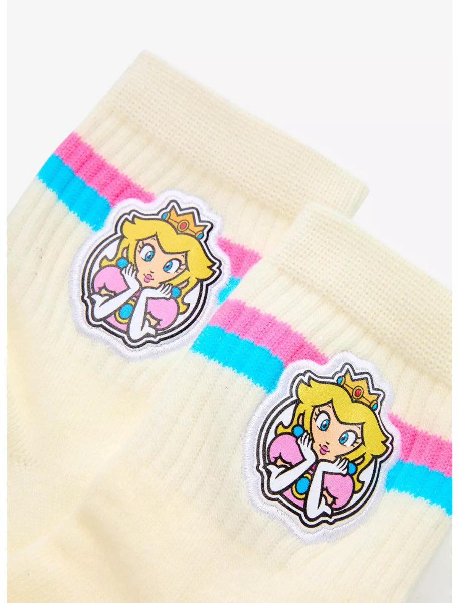 Pair of socks with colorful bands and a Super Mario Bros. Princess Peach character design on a white background