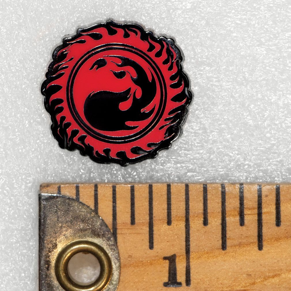Enamel pin with red mountain fire mana from Magic: The Gathering available at chimploot.com