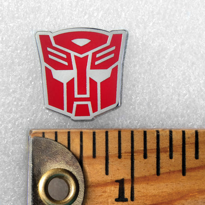 Transformers autobot enamel pin packaging with logo and text