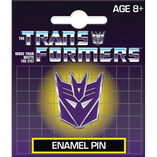 Transformers enamel pin packaging with purple and white logo on a dark background