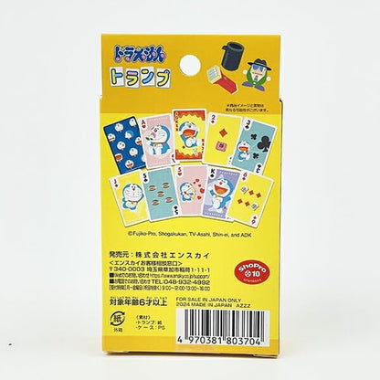 Yellow retail box for a Doraemon-themed card game, shown from the back with Japanese text, illustrated cards, a barcode, and a Shop Glico 10 logo on a white background.