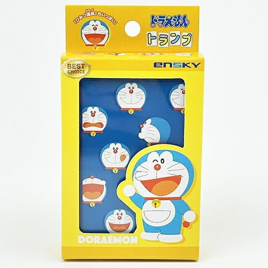 A yellow retail box for Ensky Doraemon-themed wrist warmers, featuring multiple blue and white Doraemon illustrations on the front window.