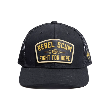 A black Star wars trucker-style cap with a curved brim, black mesh back, and a large front patch reading 'REBEL SCUM FIGHT FOR HOPE' in gold lettering with a small central emblem. A small side patch is also visible.