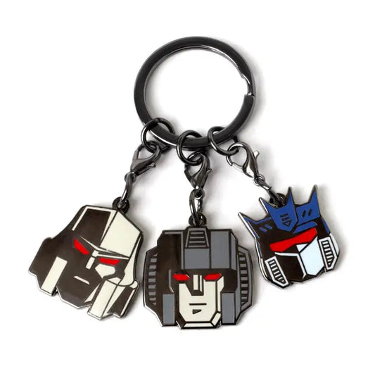 Keychain with three Transformers decepticon heads on a white background