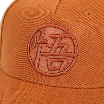 Orange Dragon Ball Z Goku's Symbol cap with a logo on a white background