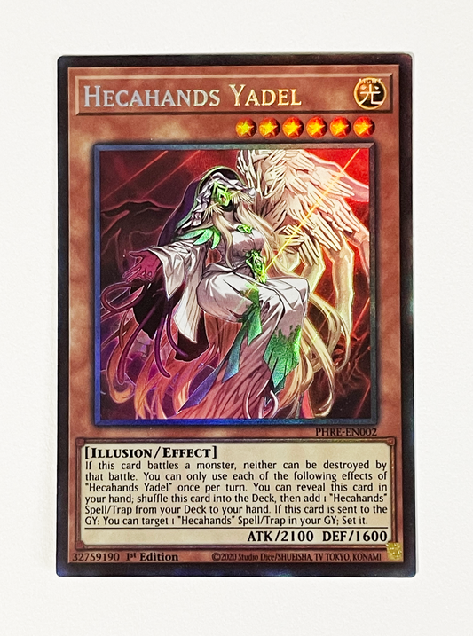 Trading card featuring a character named Hecahands Yadel with detailed artwork and text on a white background.