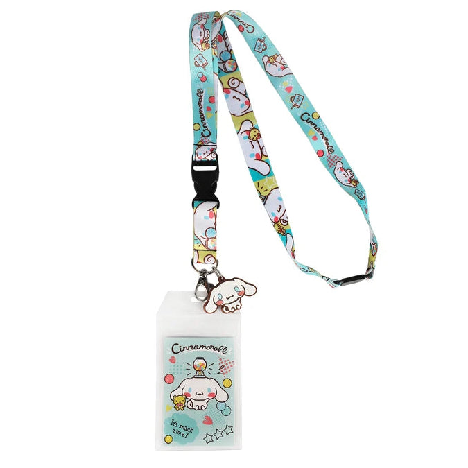 A Cinnamoroll-themed lanyard with an ID holder, featuring a light blue patterned strap with cartoon illustrations and a matching clear ID card sleeve with a Cinnamoroll charm.