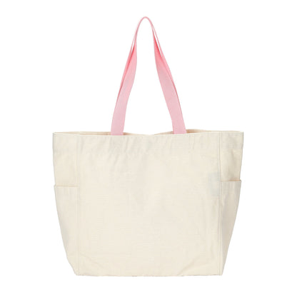 An off-white canvas tote bag with light pink shoulder straps, shown against a plain white background.