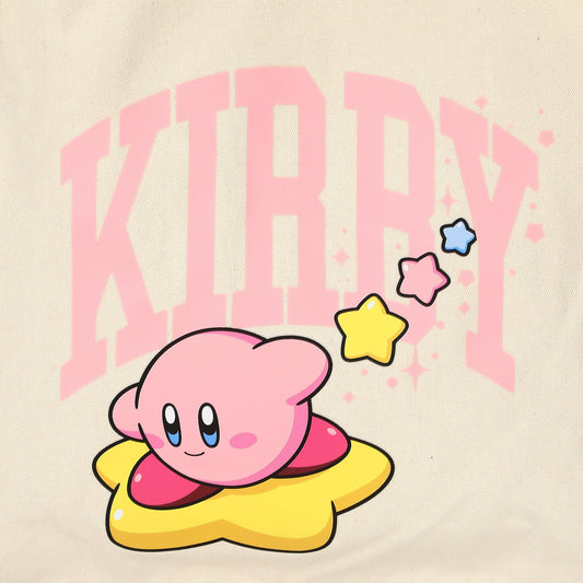 A close-up of a light beige fabric featuring a printed graphic of Kirby sitting on a yellow star, with large pink text reading 'KIRBY' behind him and small colorful stars.