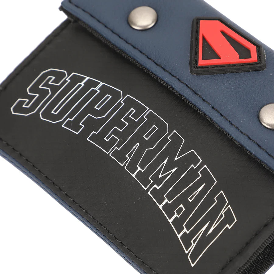 Superman tri-Fold Wallet logo on a blue and black wallet with a red and black triangle emblem.
