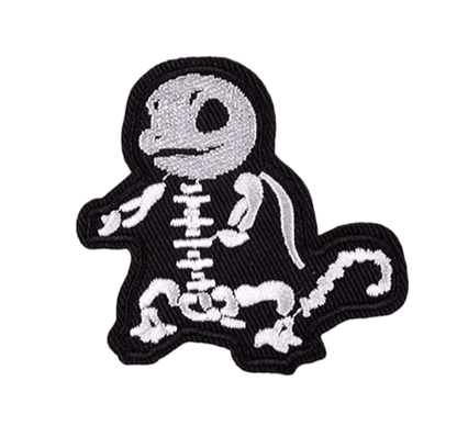 Embroidered patch of a skeleton pokemon squirtle on a white background