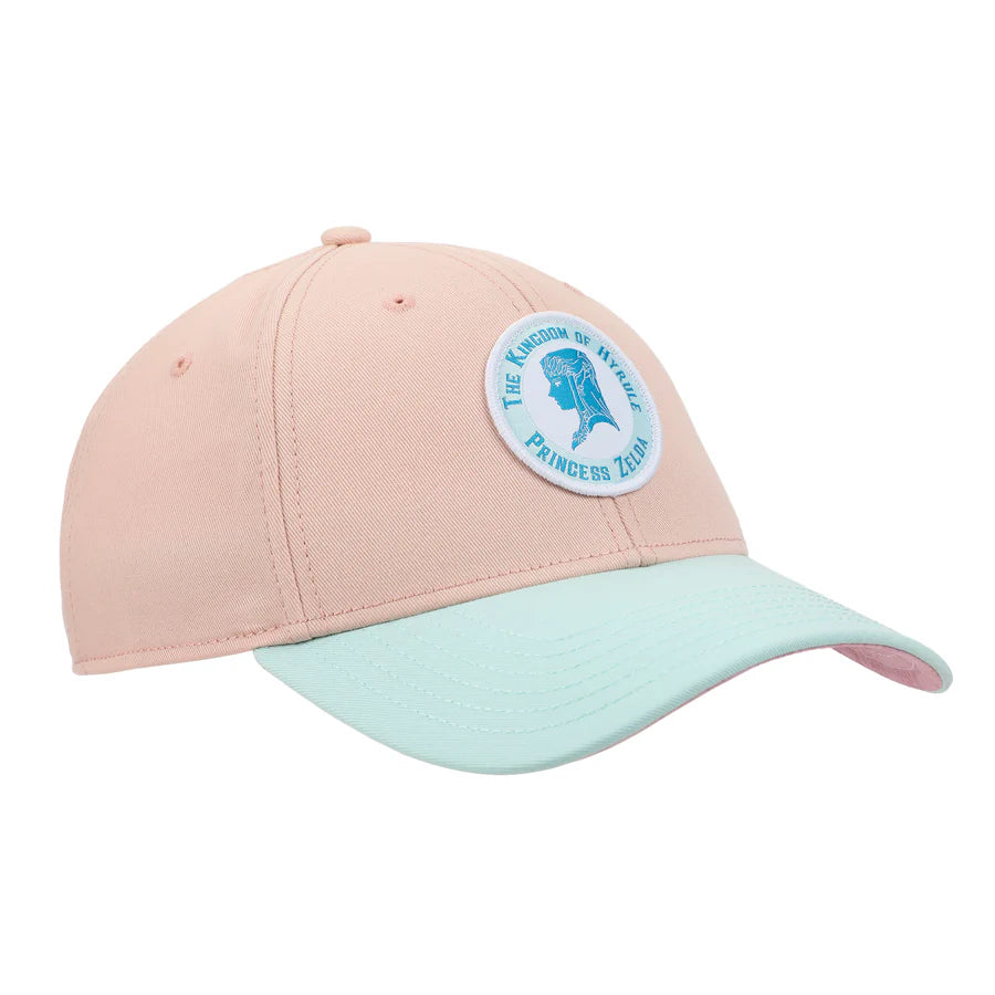 Pink and light blue cap with The Legend Of Zelda Princess Zelda Patch circular emblem on a white background