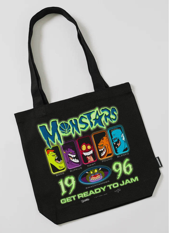 Black tote bag with colorful 'Space Jam Monstars '96' design on a white background