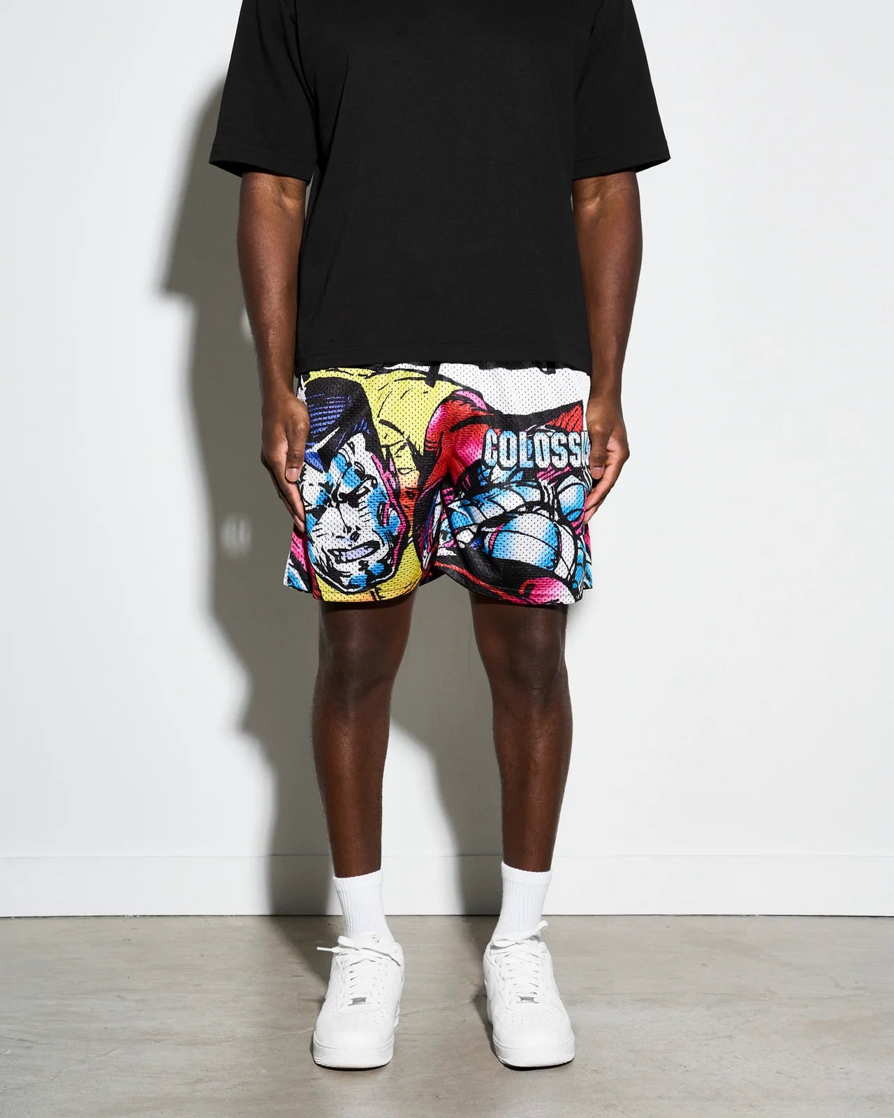 Colorful athletic shorts with Marvel X-men Colossus  graphic design on a white background