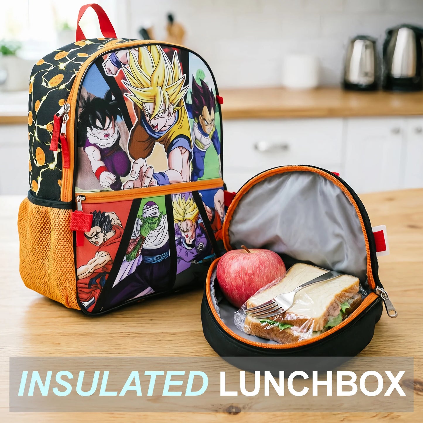 A Dragon Ball Z themed lunch bag and matching insulated lunchbox on a wooden table in a kitchen setting. The lunch bag features colorful anime characters, and the open lunchbox contains a sandwich, apple, and fork.