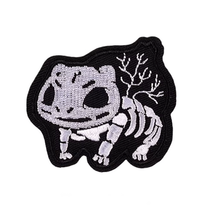 Embroidered patch of a skeleton pokemon Bulbasaur on a white background
