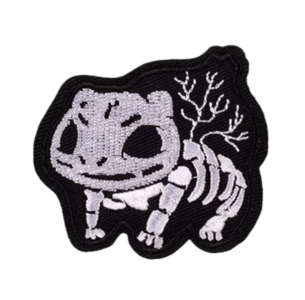 Embroidered patch of a skeleton pokemon Bulbasaur on a white background