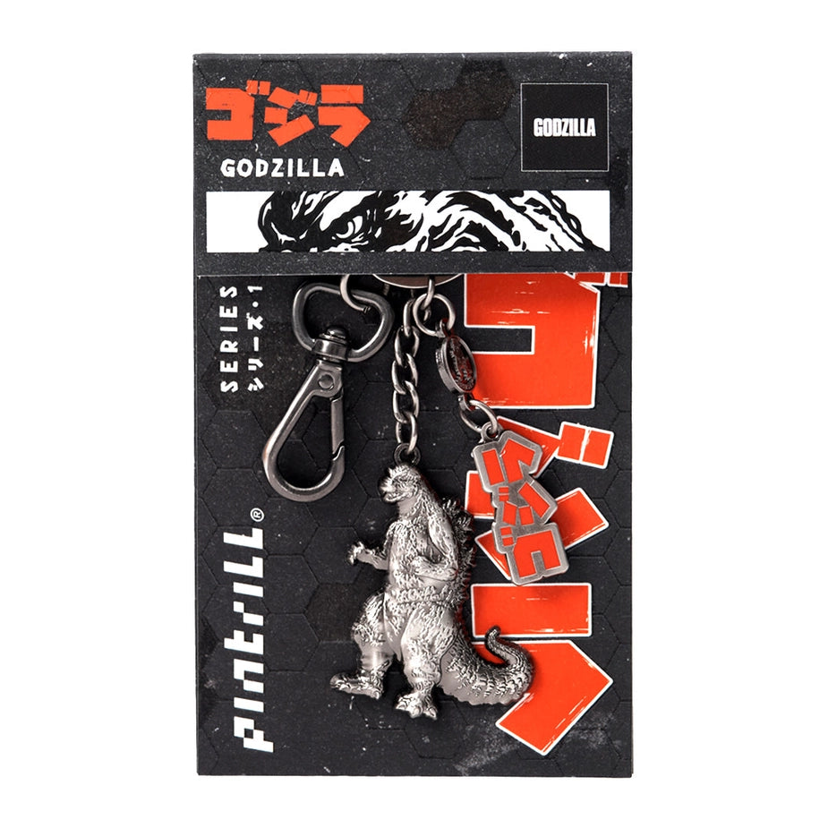 Godzilla keychain on a black packaging with branding