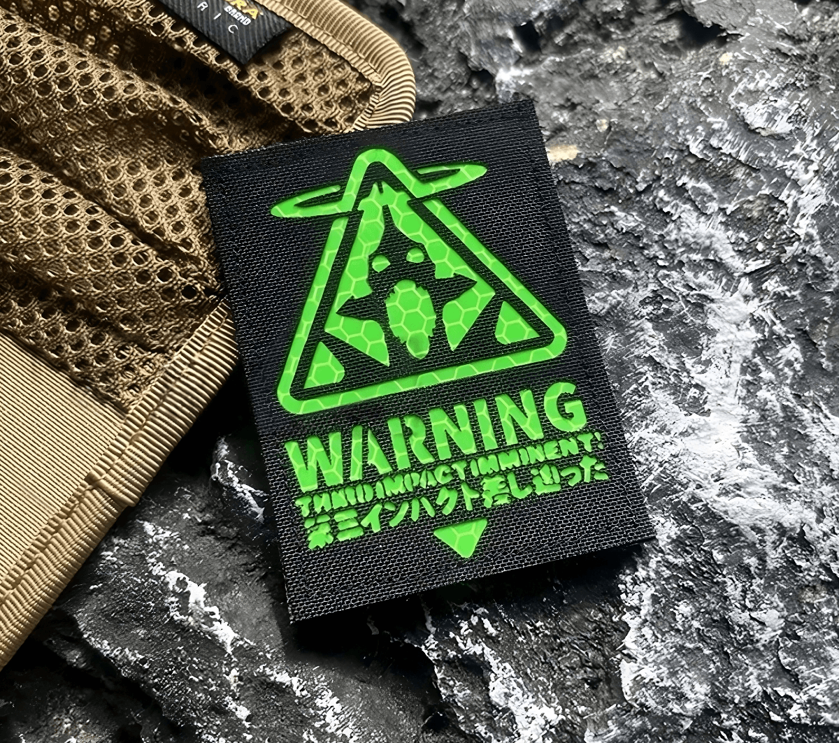 Black patch with green Evangelion Third Impact Reflective Hook & Loop Patch warning symbol and text on a white background