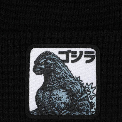 Embroidered patch of Godzilla with Japanese text on a black background
