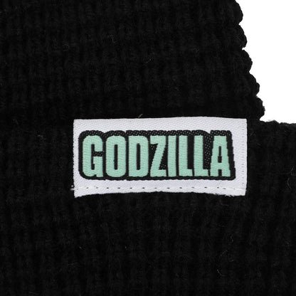Close-up of black shoelace with 'GODZILLA' label on a white background