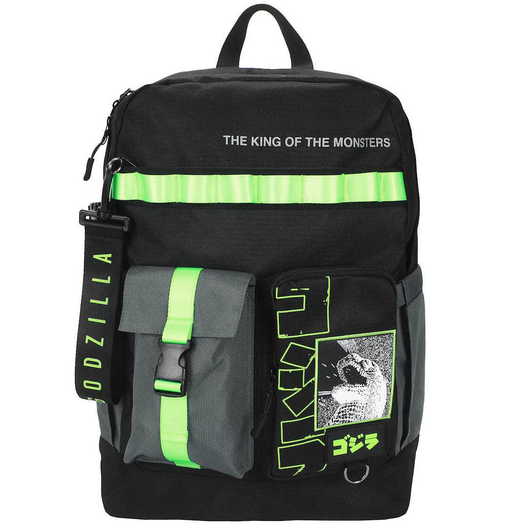 A black Godzilla backpack with bright neon green reflective stripes, a vertical green-and-black strap, and a front pocket featuring a graphic print and green text, shown on a plain white background.