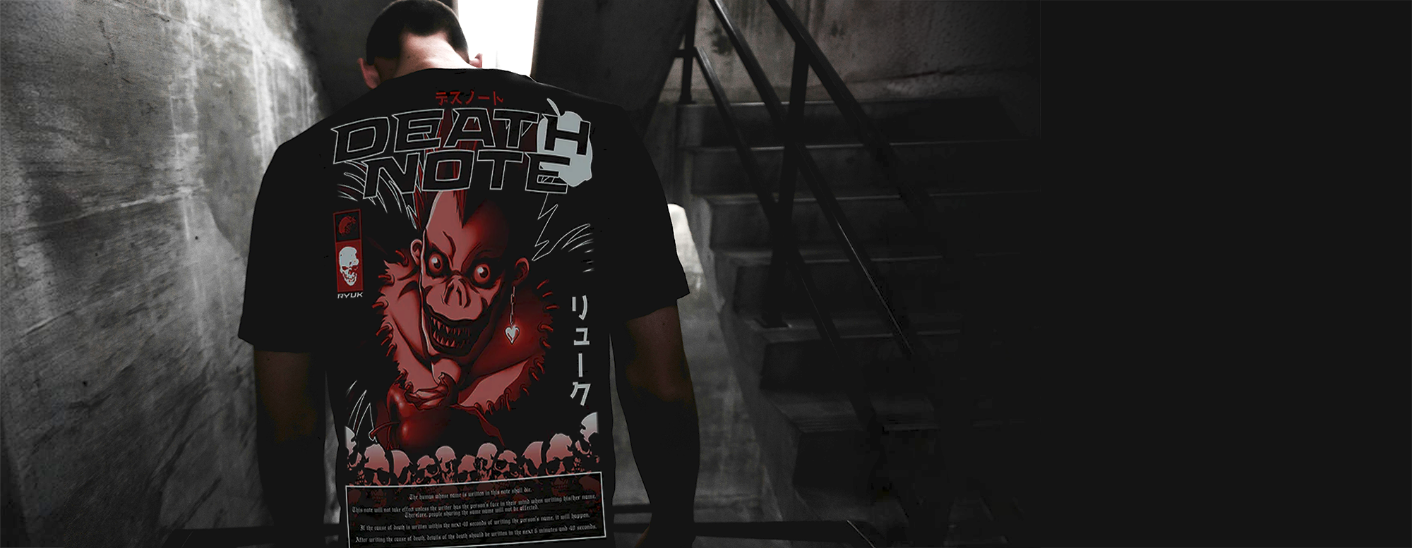 Person wearing a 'Death Note' themed t-shirt in a dark, industrial setting.