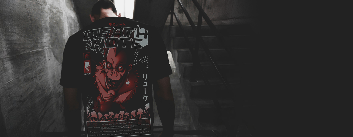 Person wearing a 'Death Note' t-shirt with a dark, moody background