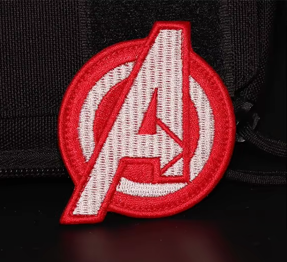 Avengers logo patch on a black background available at chimploot.com