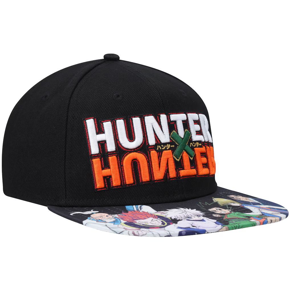 A black snapback cap featuring 'HUNTER X HUNTER' text on the front in white and orange with a green X, and an anime character print on the flat brim.