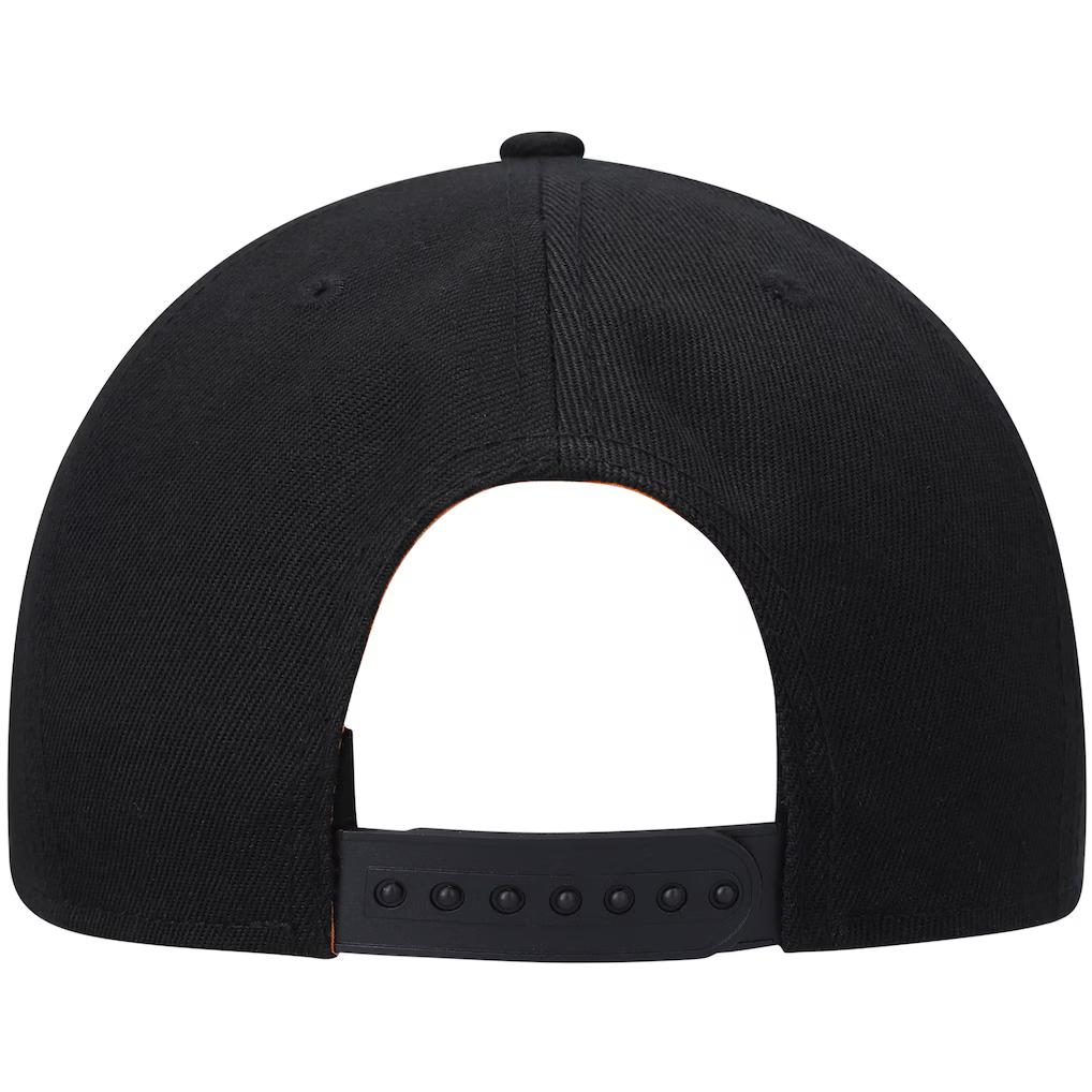 Rear view of a black snapback cap on a solid white background, showing the fabric texture and adjustable strap.