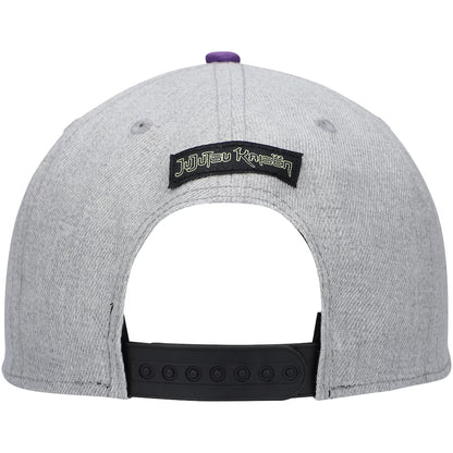 The back of a heather gray snapback cap featuring a black patch with the text 'jujutsu kaisen' in white and black, a black adjustable strap, and a small purple button on top.
