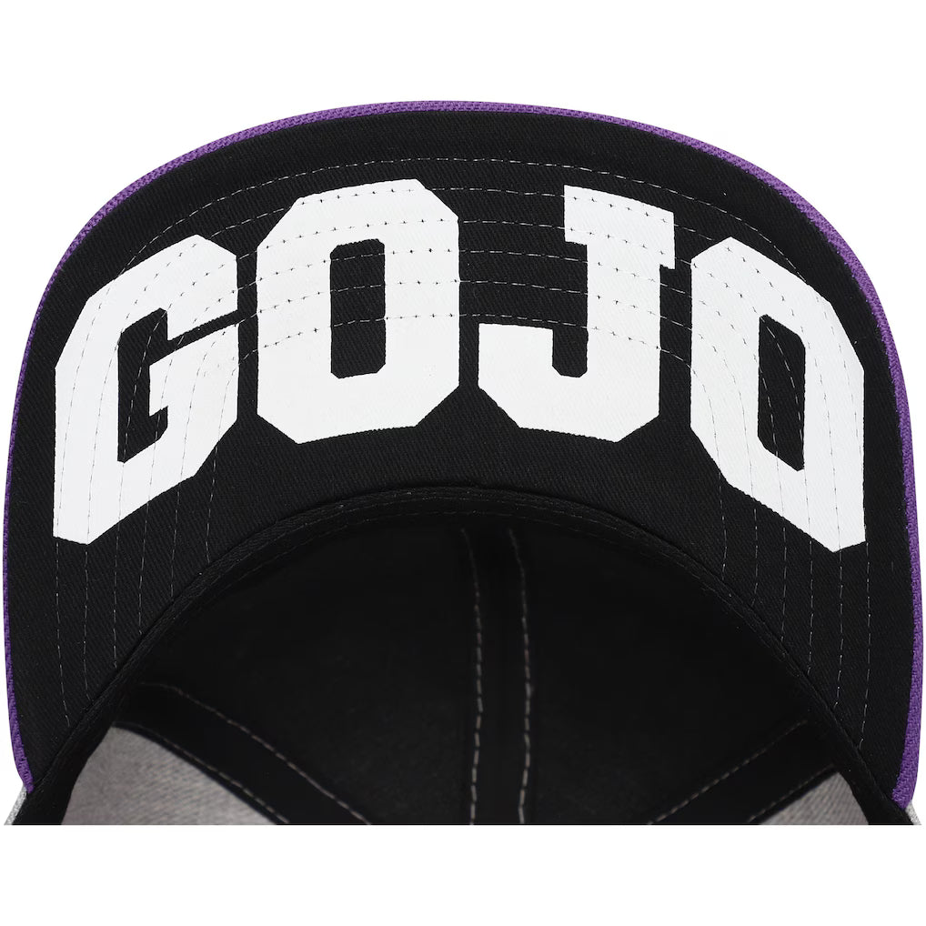 Close-up of a black baseball cap with large white 'GOJO' lettering on the front panel and a purple stitched edge.