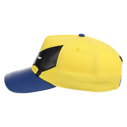A yellow and blue baseball cap featuring a x-men wolverine black mask design on the front, resembling a superhero wolverine character, shown against a plain white background.