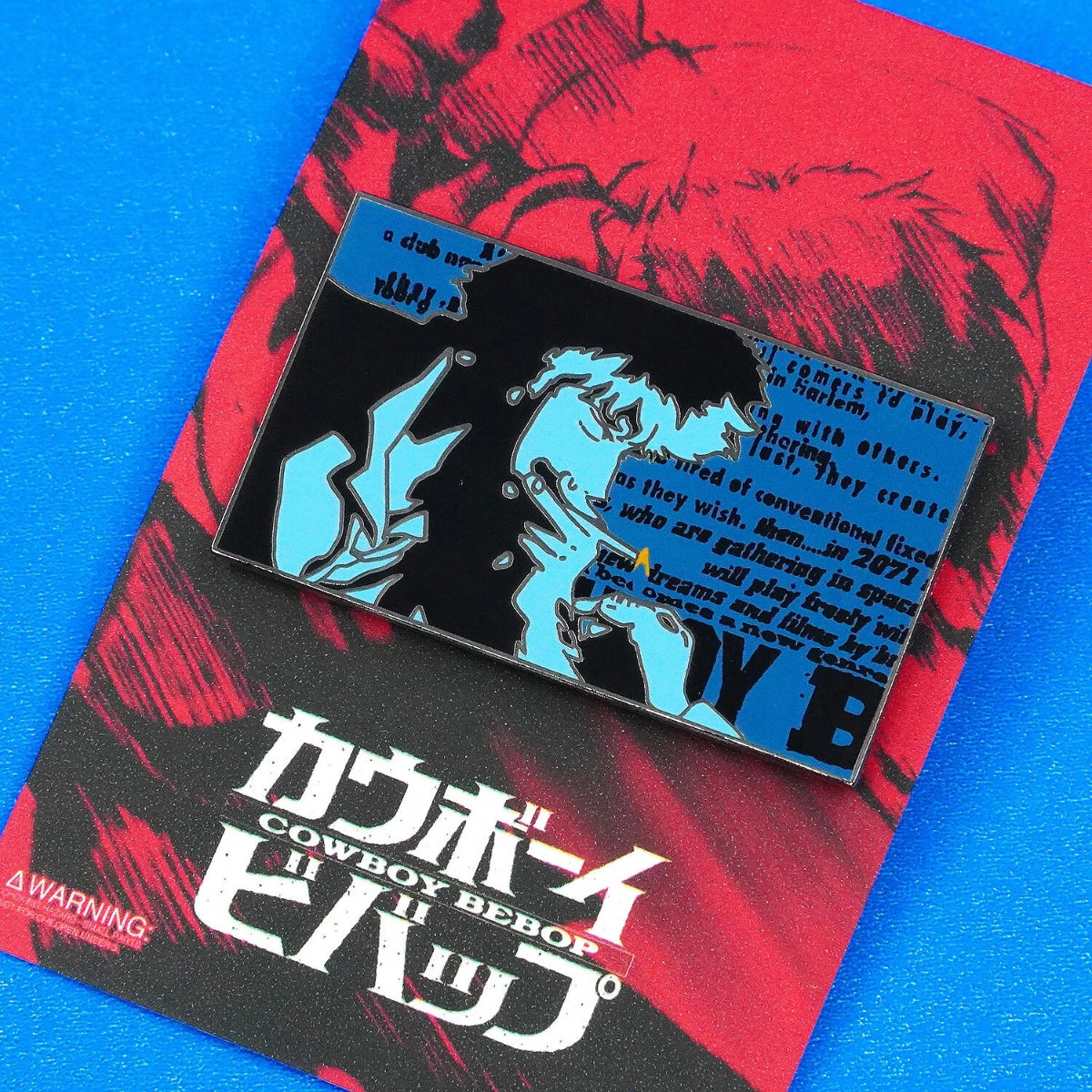 Enamel pin with anime design on a 'Cowboy Bebop' poster