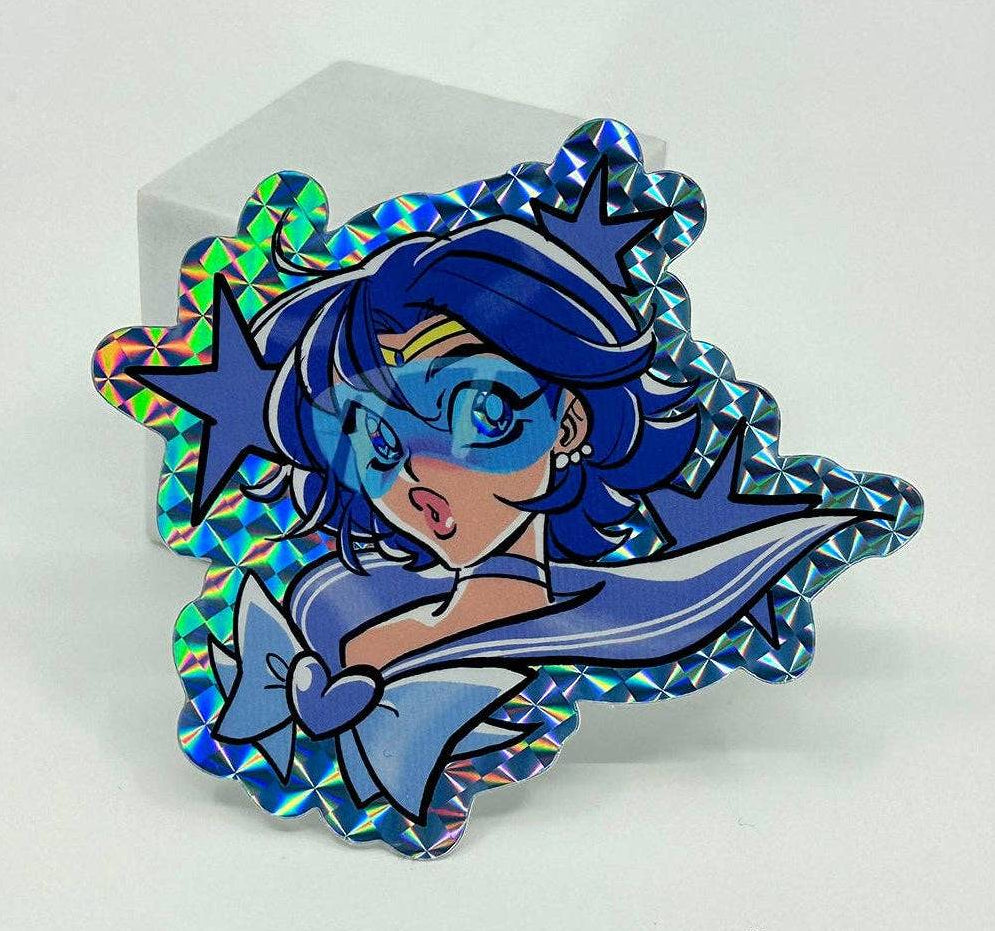 A Sailor Moon Sailor Scout Mercury holographic sticker with a blue iridescent border, shown on a white background.