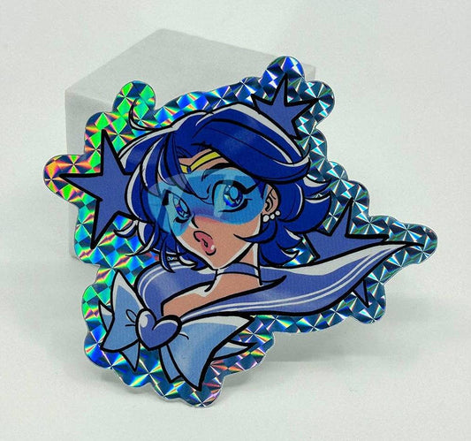 A Sailor Moon Sailor Scout Mercury holographic sticker with a blue iridescent border, shown on a white background.