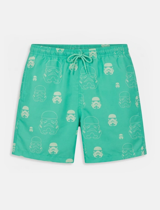 Green swim shorts with stormtrooper pattern on a white background